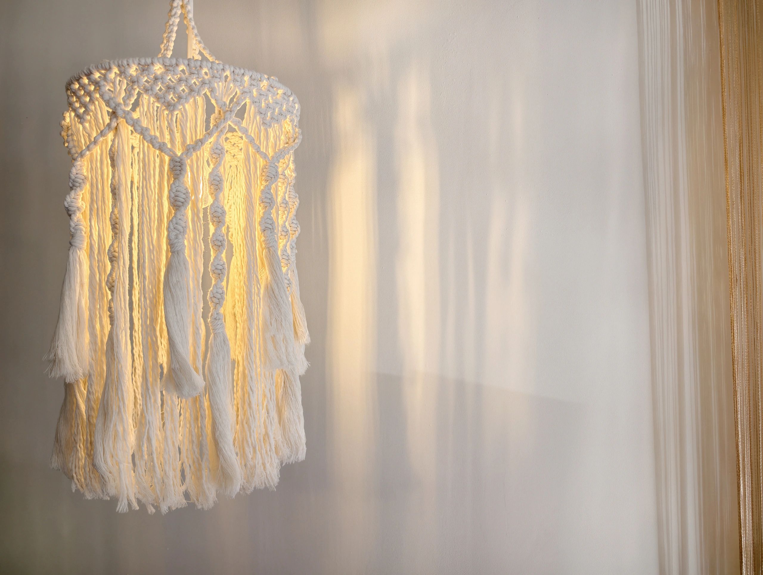 Boho macrame pendant lamp in a minimalist interior